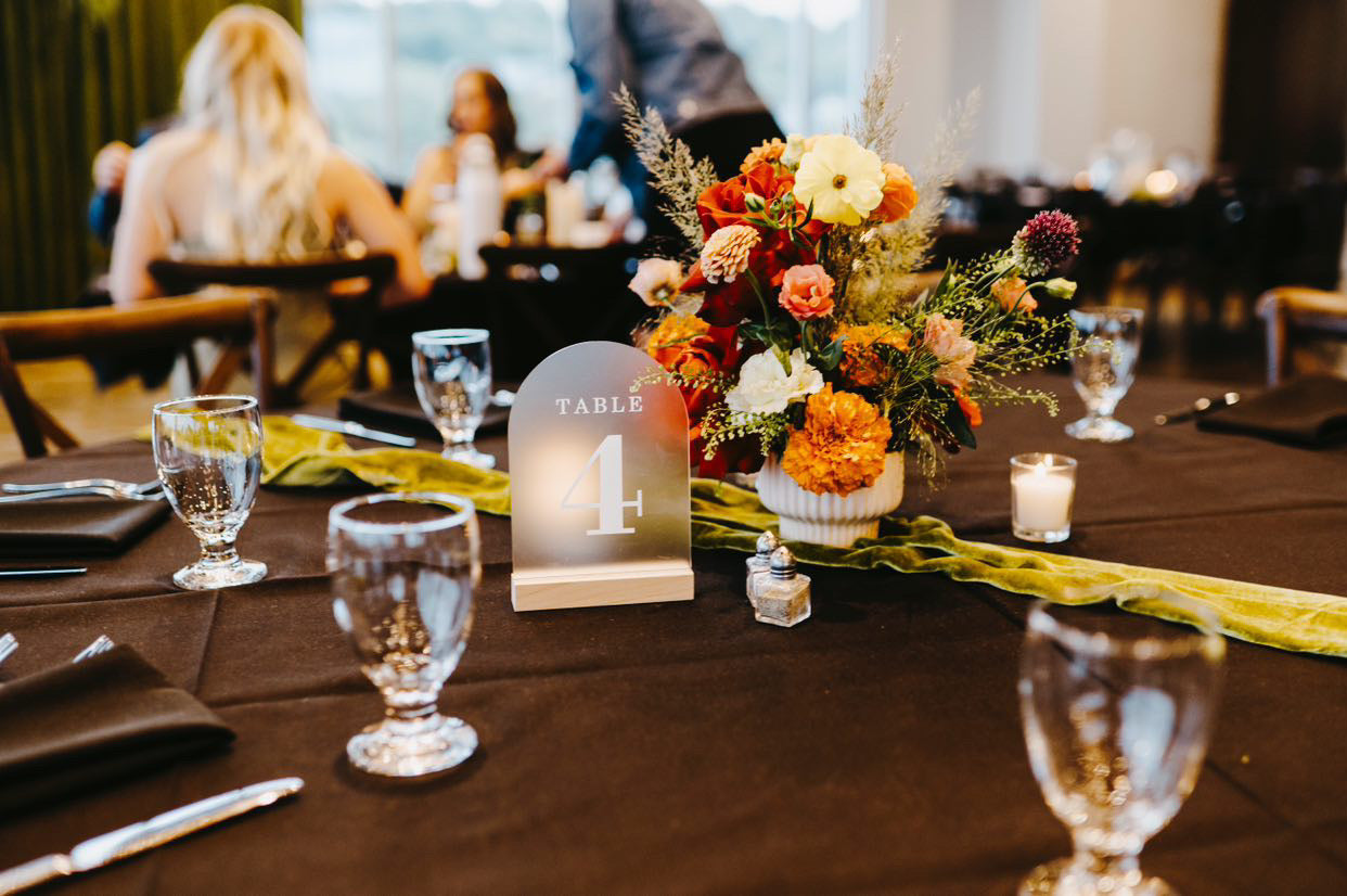 large wedding centerpiece on a table with flower arrangement by In Flower, flower shop in Sioux Falls, SD